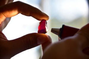 A worker examines a large ruby at Gemfields' mine near Montepuez in Mozambique